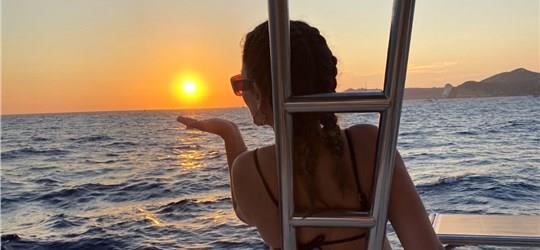 Photo of Scenic Catamaran Trip around Santorini with BBQ and Beverages