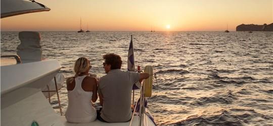 Photo of Caldera Gold Catamaran Cruise in Santorini with BBQ Meal and Drinks