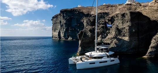 Photo of Scenic Catamaran Trip around Santorini with BBQ and Beverages
