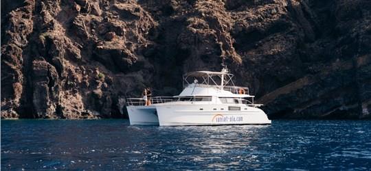 Photo of Private Power Catamaran Cruise in Santorini with BBQ and Drinks