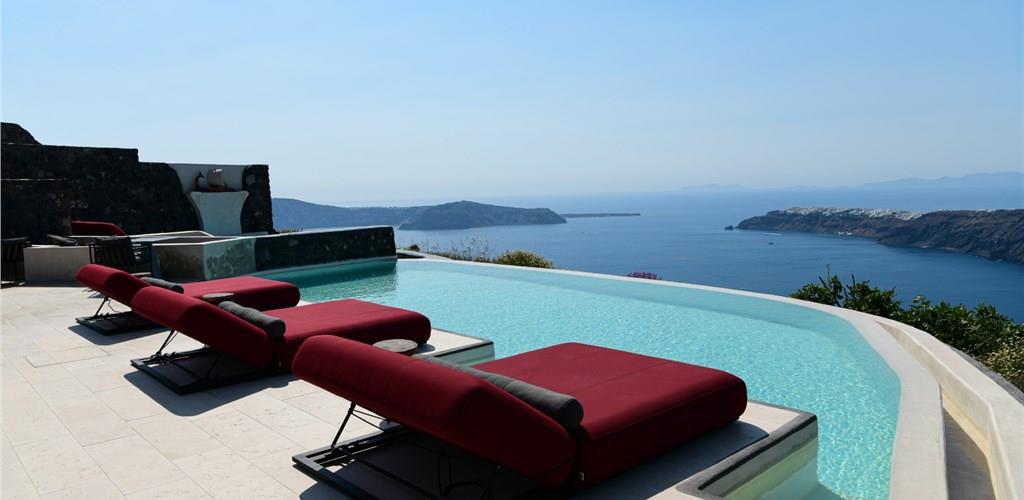 Photo of Unwind on a Sunbed with Infinity Pool Access and Stunning Caldera Views
