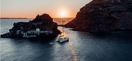 Photo of Beautiful Catamaran Cruise in Santorini with BBQ meal & drinks