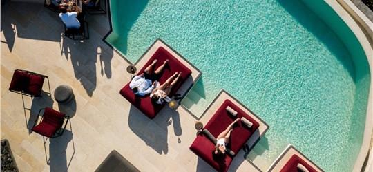 Photo of Unwind on a Sunbed with Infinity Pool Access and Stunning Caldera Views