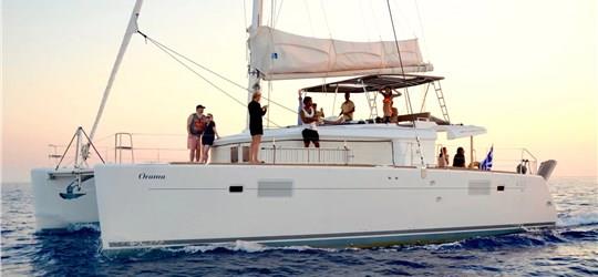 Photo of Caldera Gold Catamaran Cruise in Santorini with BBQ Meal and Drinks