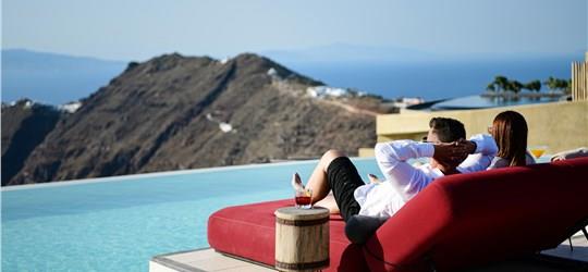 Photo of Unwind on a Sunbed with Infinity Pool Access and Stunning Caldera Views